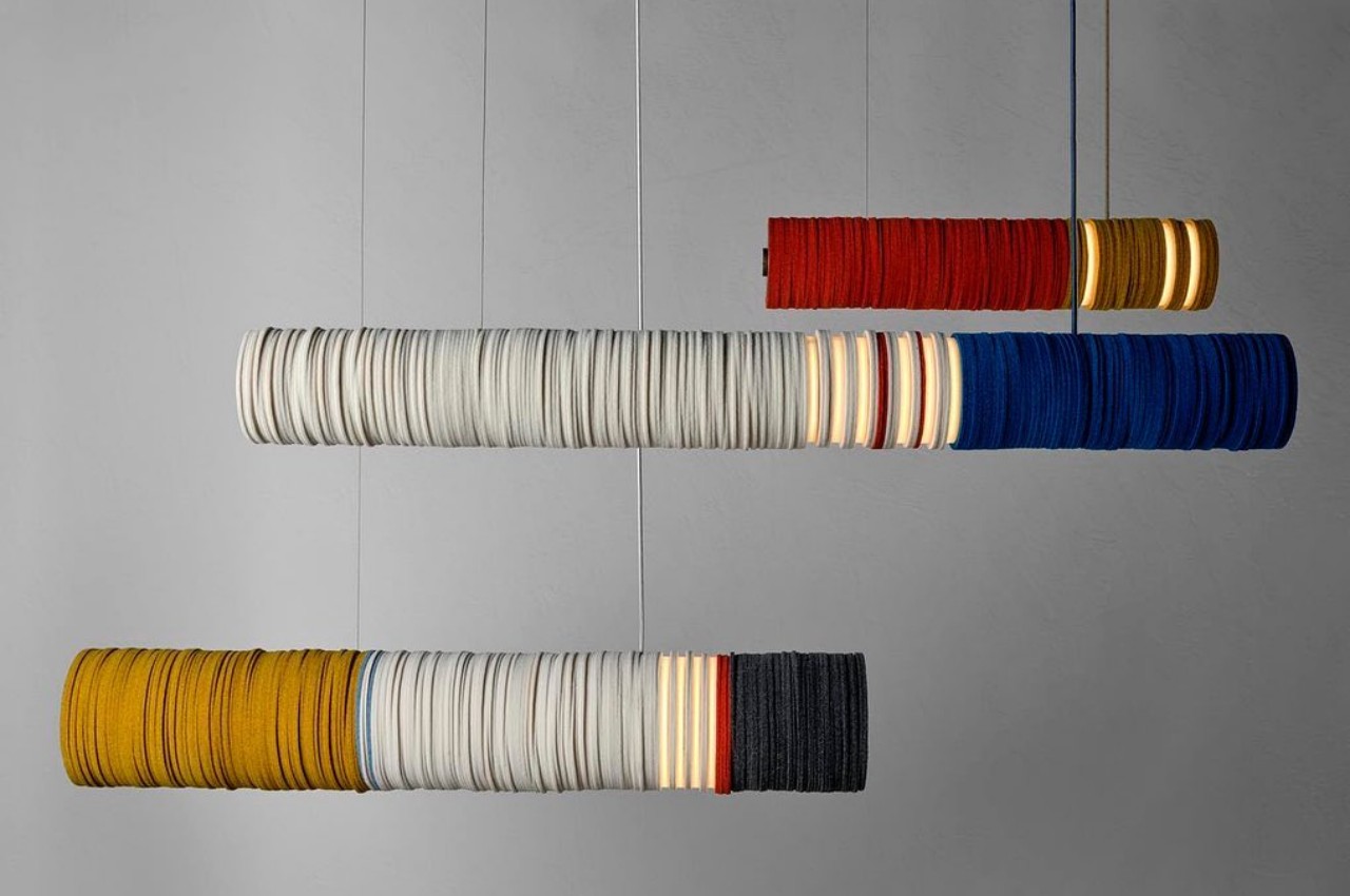 #These fuzzy pendant lights are made from stacked felt cut-offs