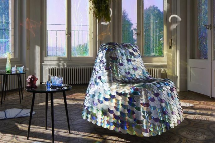 Decorative chair made of now-useless CDs and DVDs give off colorful sheen