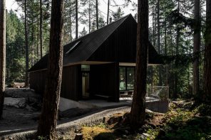 This all-black cabin in the woods in British Columbia was built to support a slow-paced and calm life