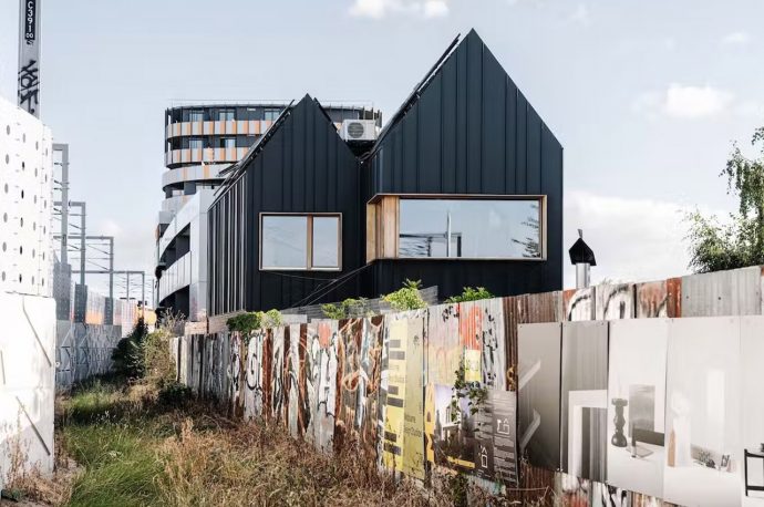 This all-black dwelling in Melbourne is a regenerative design that produces more energy than it uses