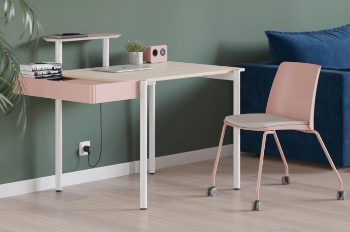 This ergonomic desk with colorful accessories helps employees ease back into their workspace