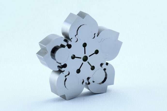 This tiny Japanese Sakura puzzle provides a difficult challenge with its 0.004mm precision design
