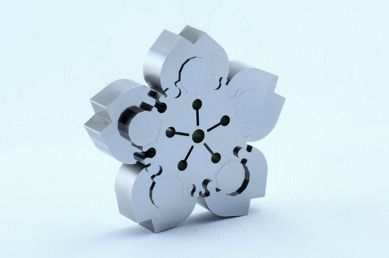 #This tiny Japanese Sakura puzzle provides a difficult challenge with its 0.004mm precision design