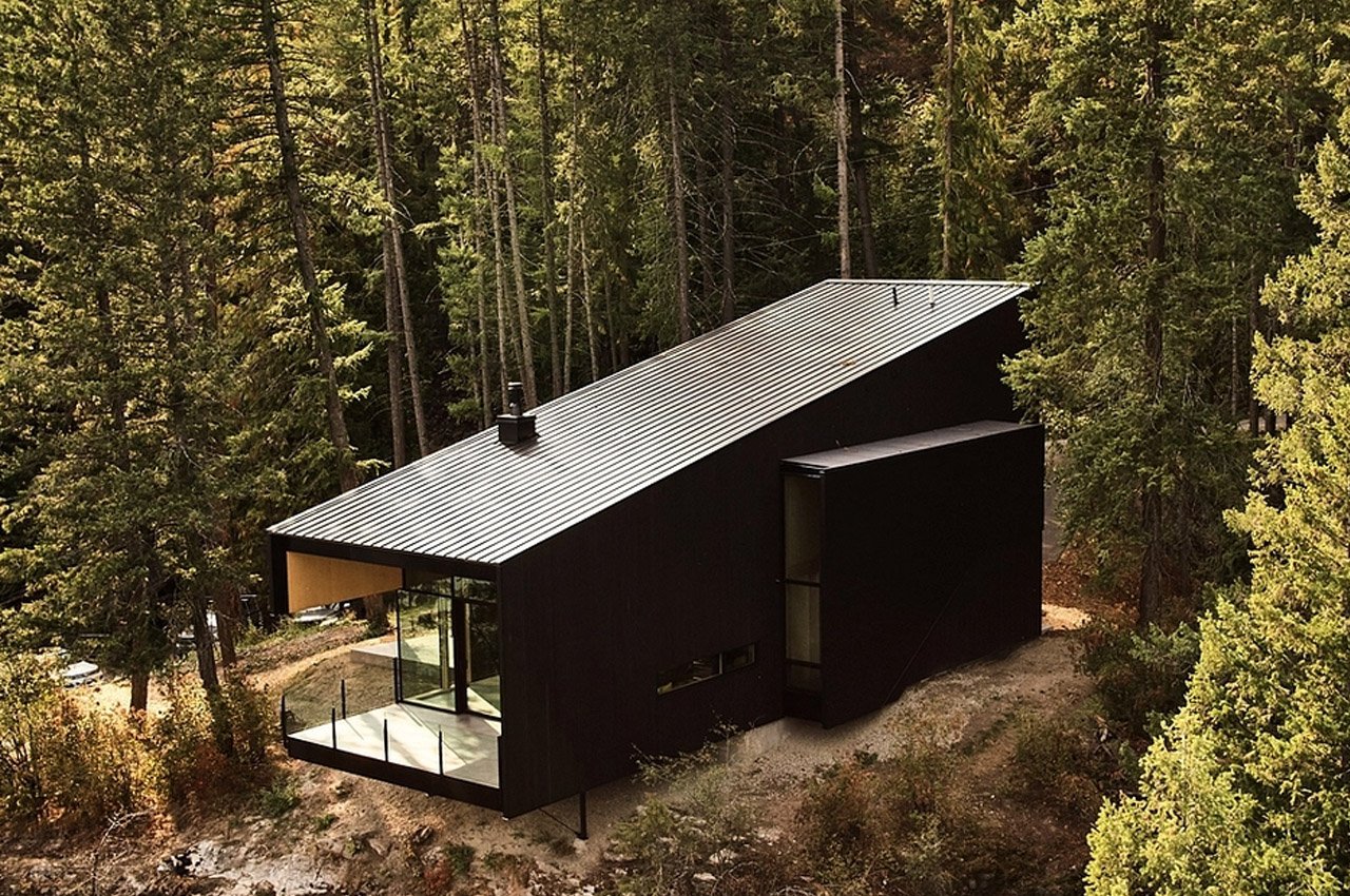 #This floating cabin in British Columbia almost disappears into its hilly landscape