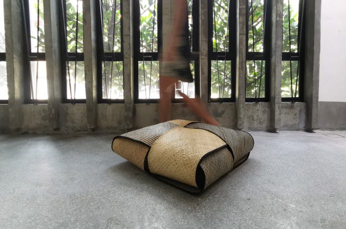 This handwoven rattan poof is inspired by a traditional Malaysian rice dumpling