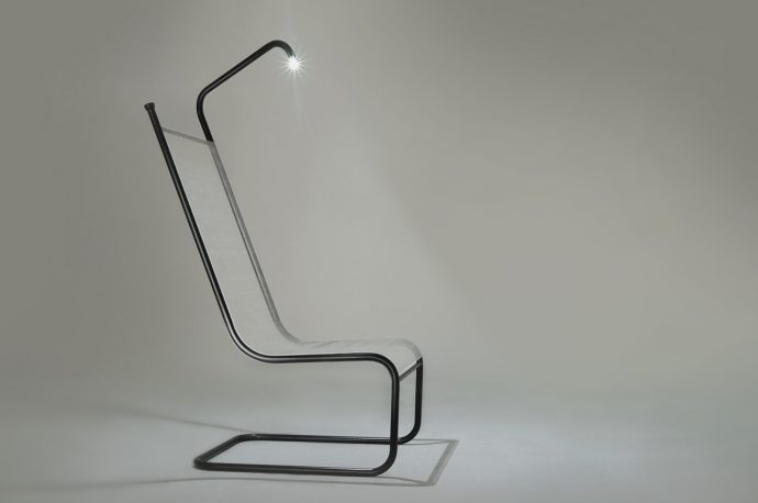 This industrial-style chair has a surprise for nighttime book lovers