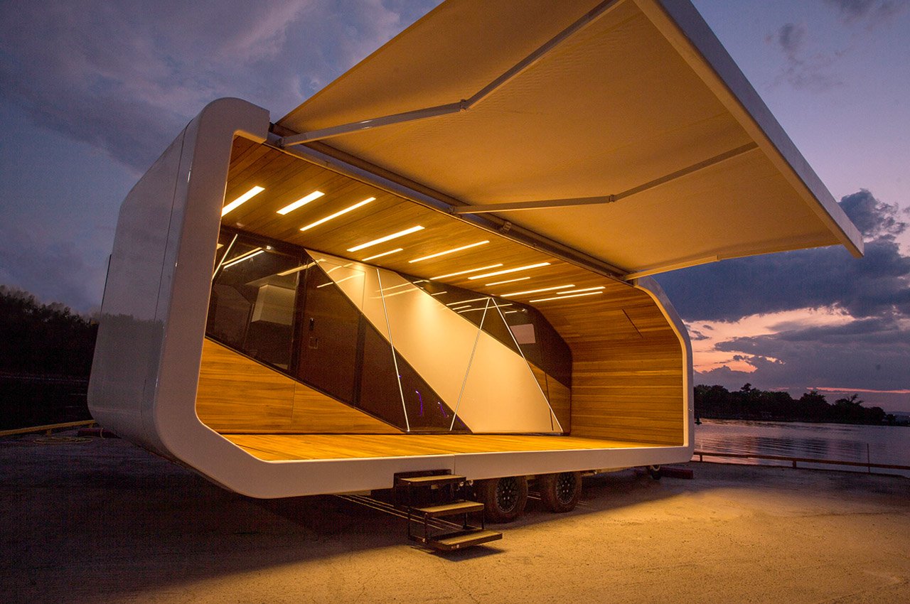 This sleek mobile home with a folding awning can extend upto 3x its original size
