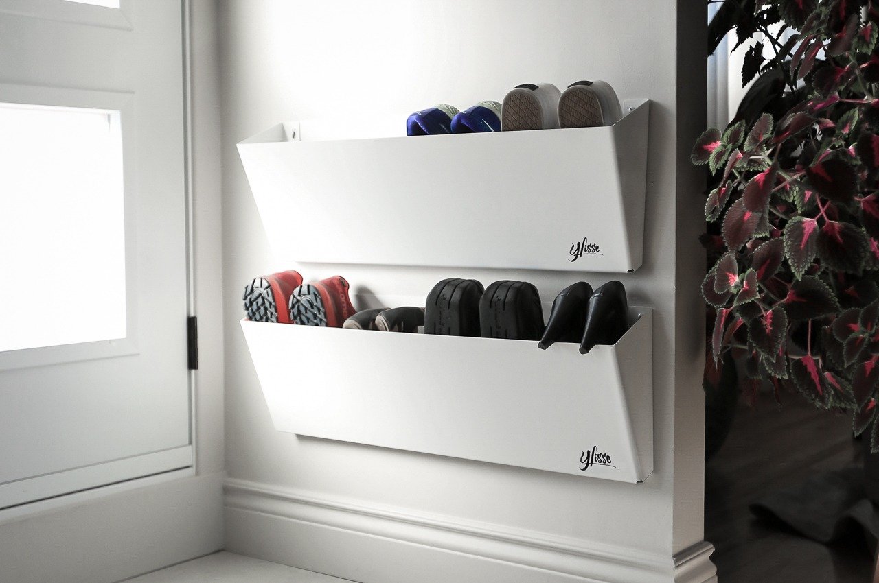Minimalist wall-mounted shoe rack helps store footwear while decluttering your space