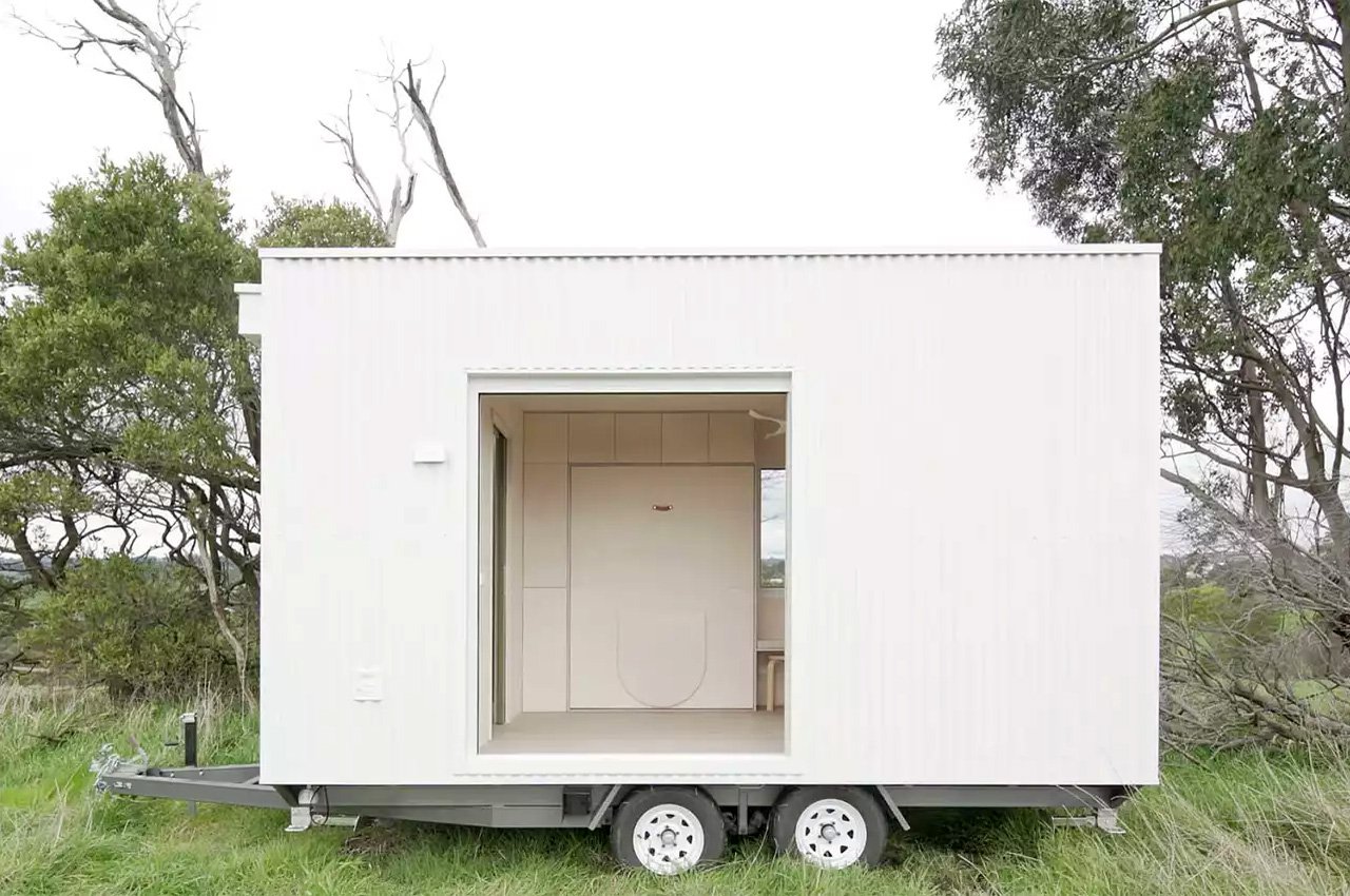 This all-white minimalist cabin is the versatile and purposeful tiny dwelling on wheels you want