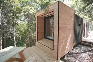 This small cabin in the woods was built using a repurposed shipping container