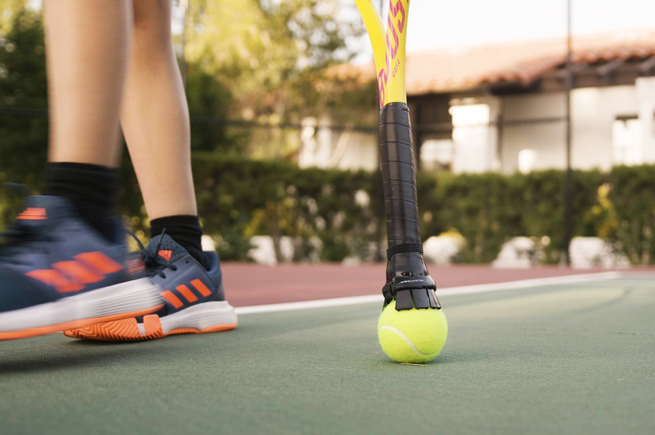#Ingenious tennis racquet grip attachment will pick up tennis balls off the ground for you