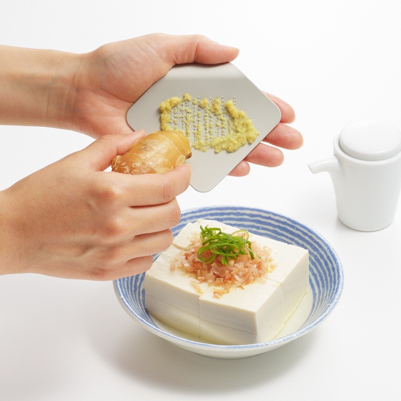 This mini handheld grater makes it easy to add flavor and joy to your meals
