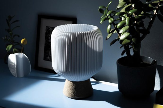 This clean minimal 3D printed lamp was made using recycled cardboard and plastic bottles