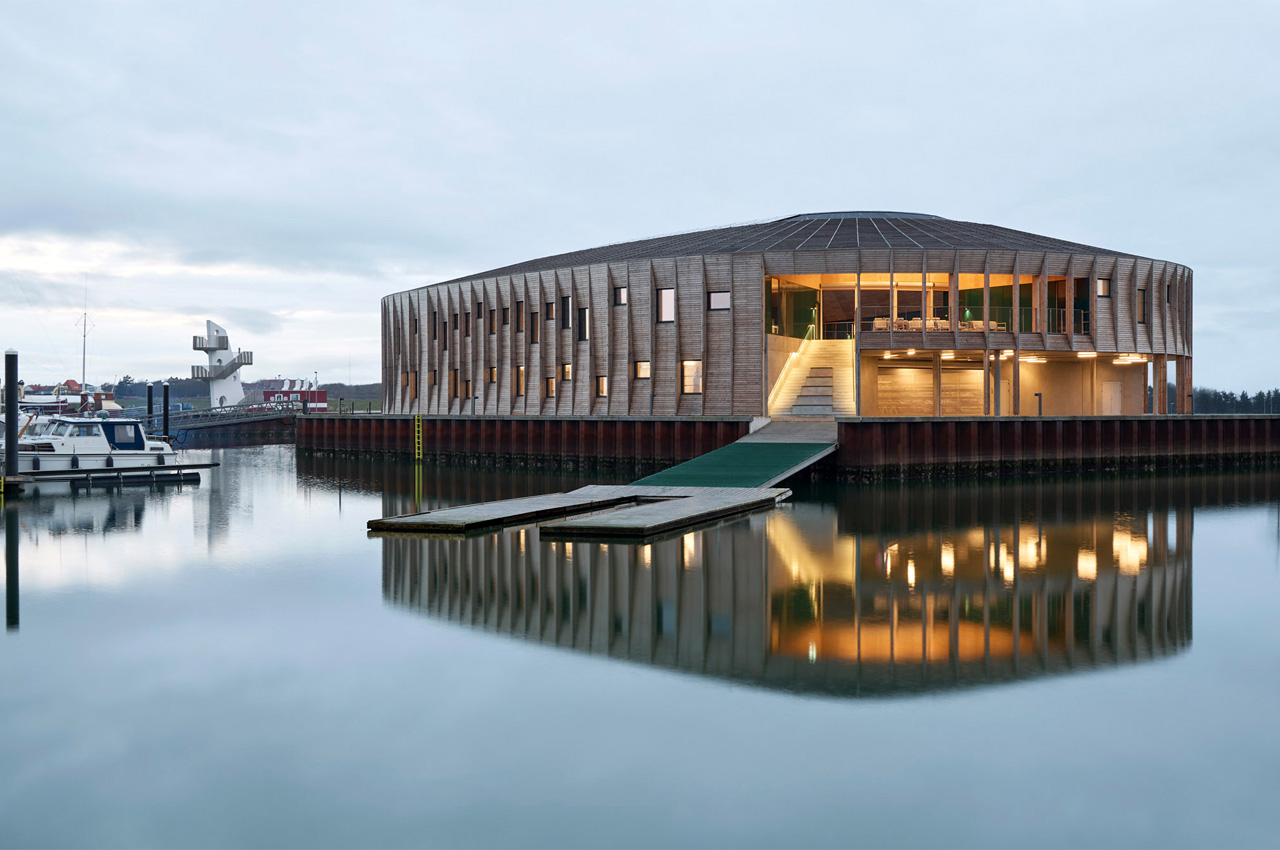 #This circular community center for water sports clubs in Denmark references maritime construction