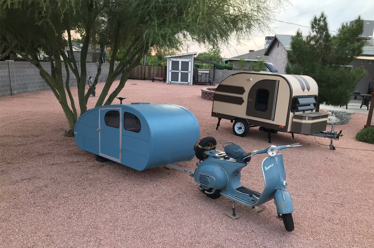 #This Vespa teardrop trailer made of foam, incorporates a functional kitchen and space to sleep the rider