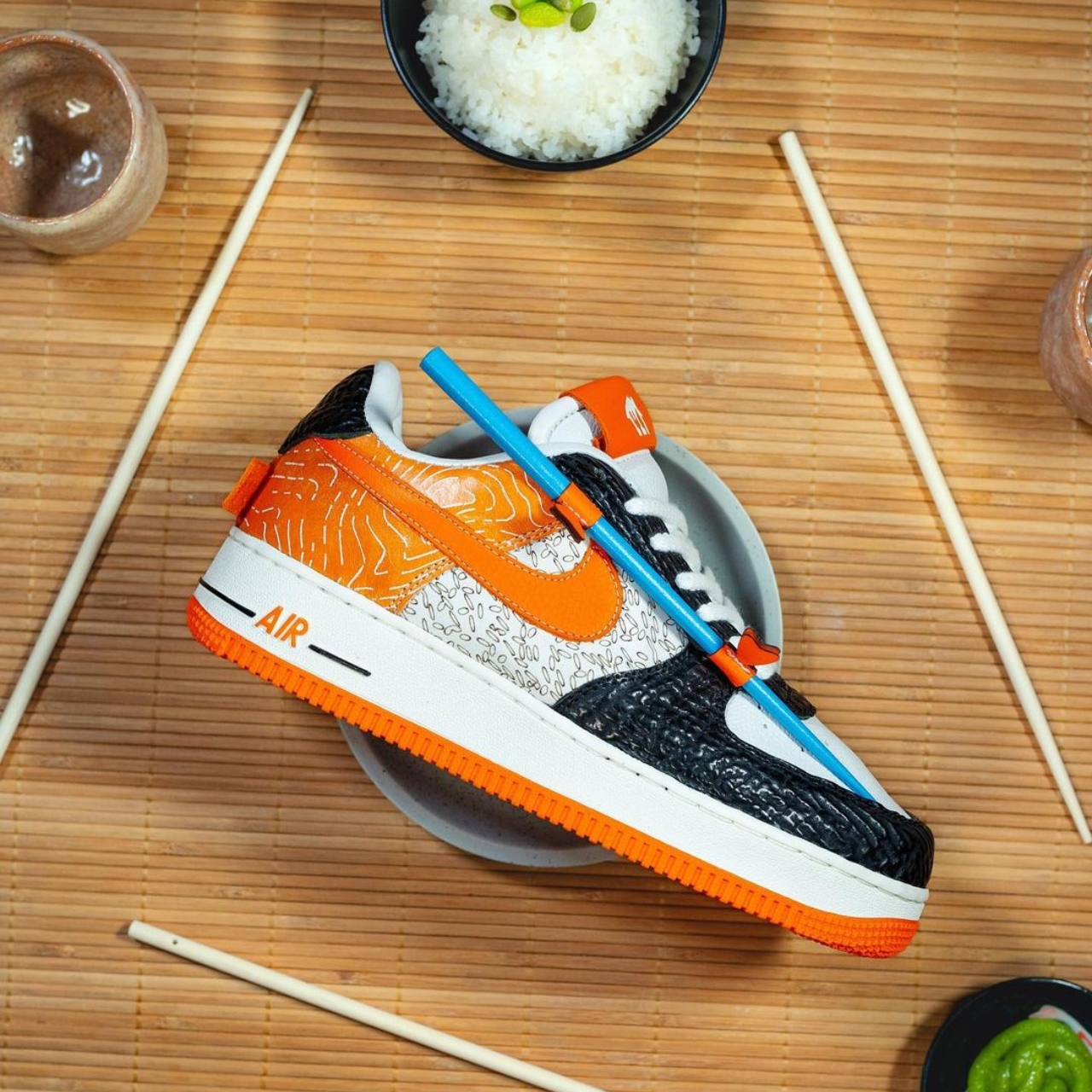Nike’s salmon sushi-inspired sneakers come with in-built chopsticks for when the hunger-pangs strike