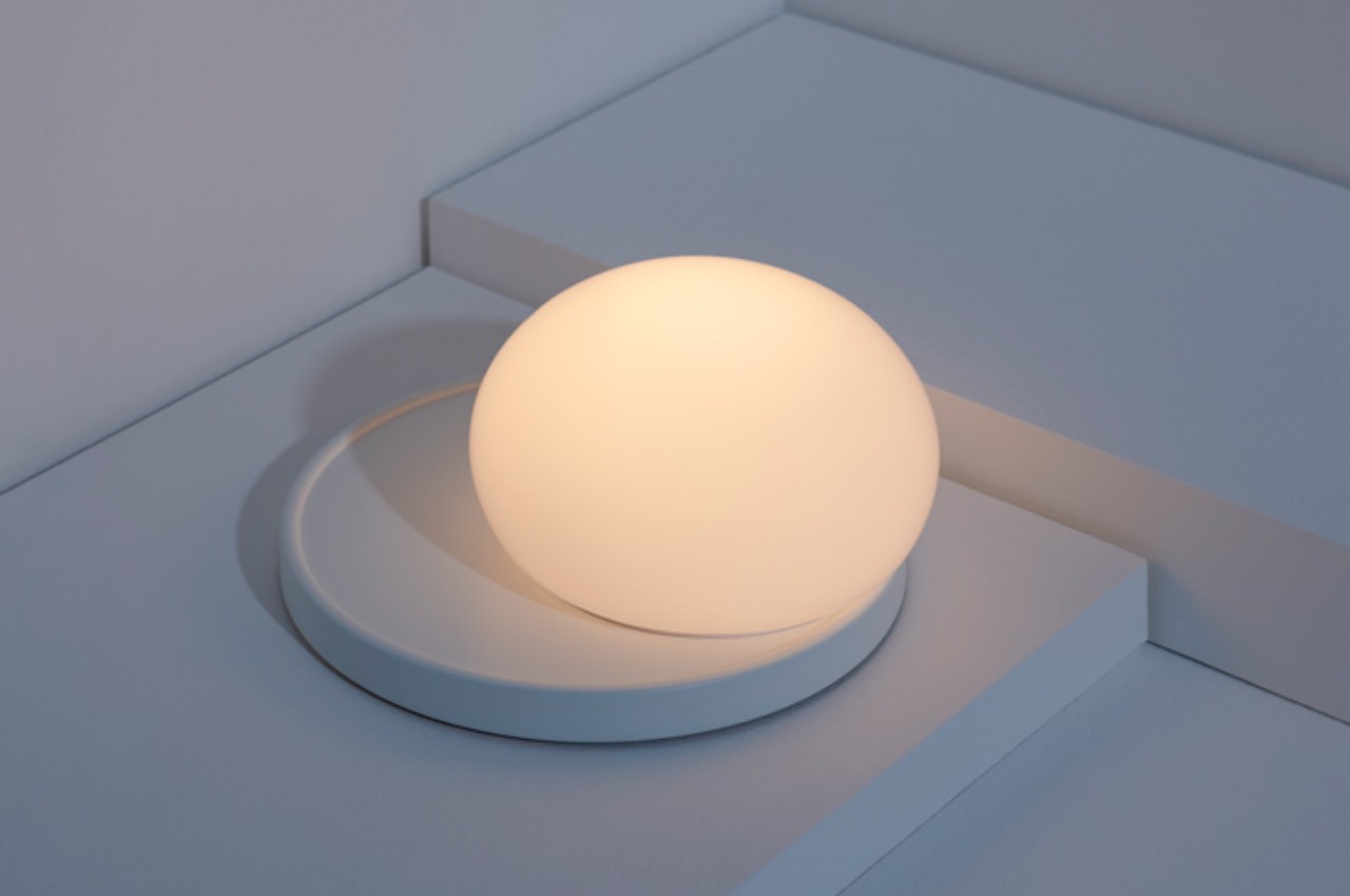 This delicate glass lamp invites you to touch and move it to actually use it