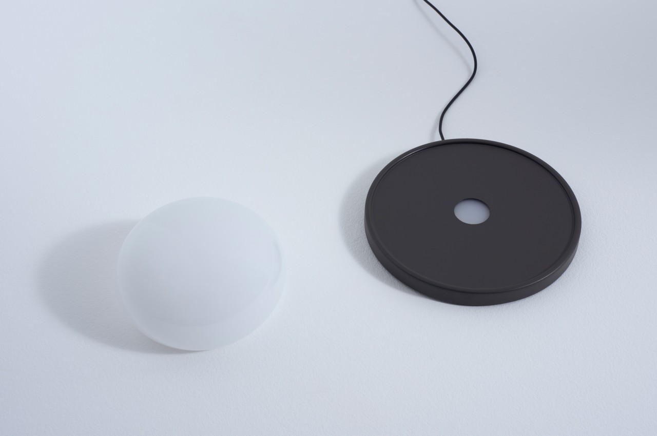 This delicate glass lamp invites you to touch and move it to actually use it