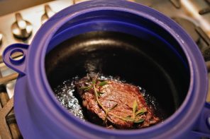 Absolutely genius silicone ‘enclosure’ sits on your utensils and creates a splatter-proof wall to keep your kitchen clean