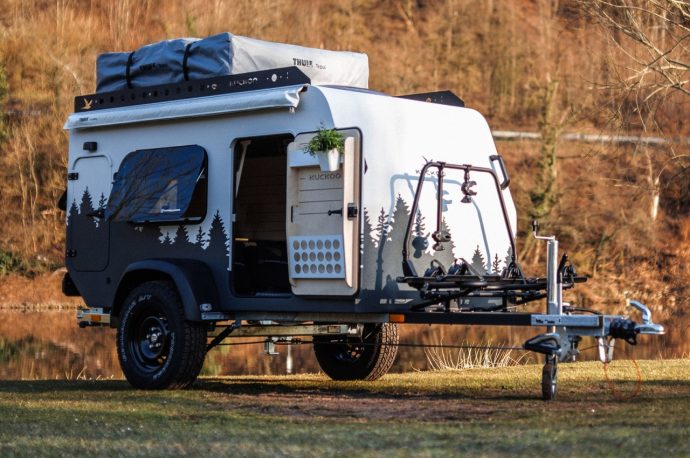 This micro camper with glass doors, oversized window and a skylight offers panoramic ride and camping halt