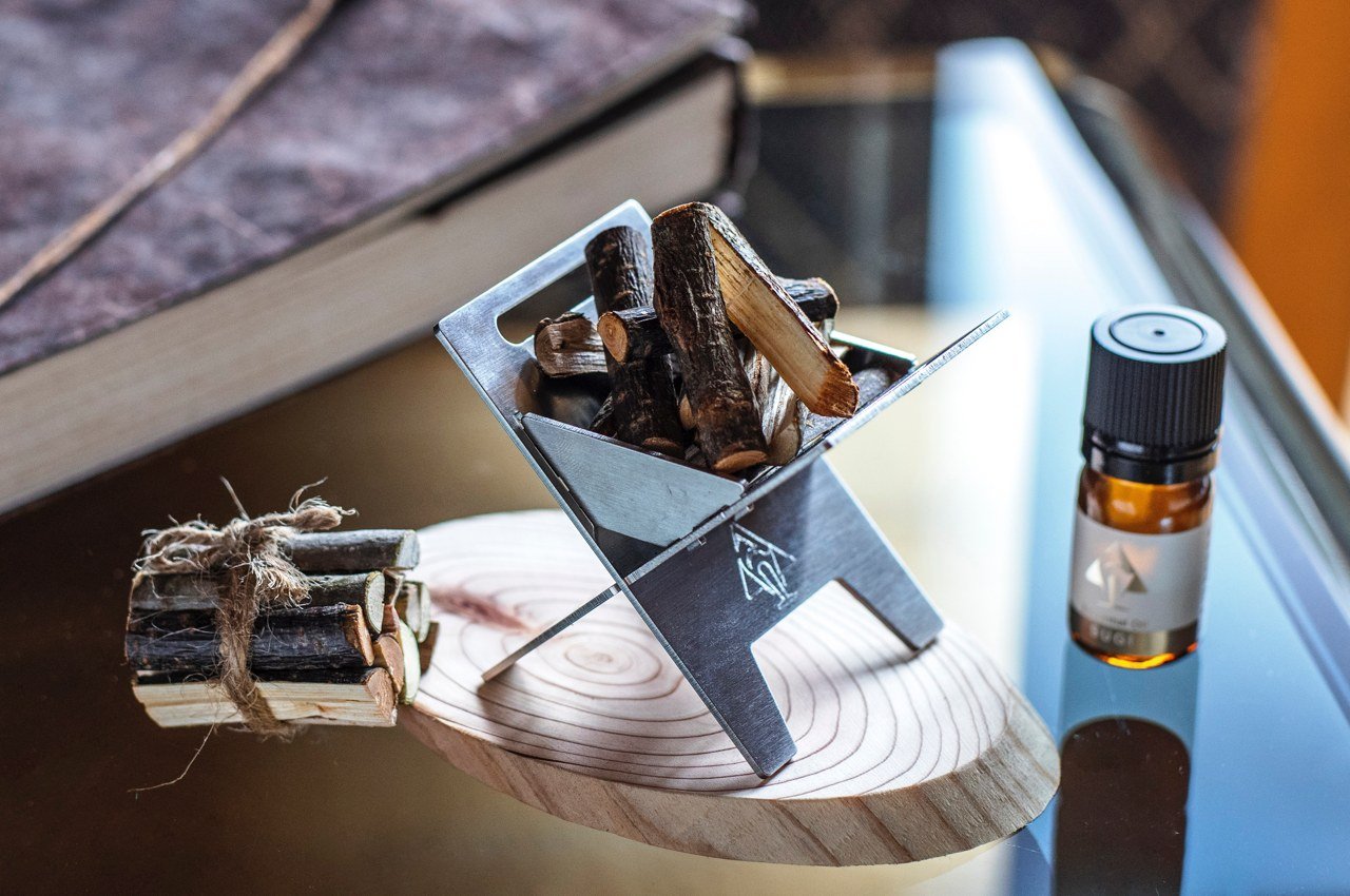 This tiny bonfire combines an aroma diffuser and pocket stove to bring the outdoor experience indoor