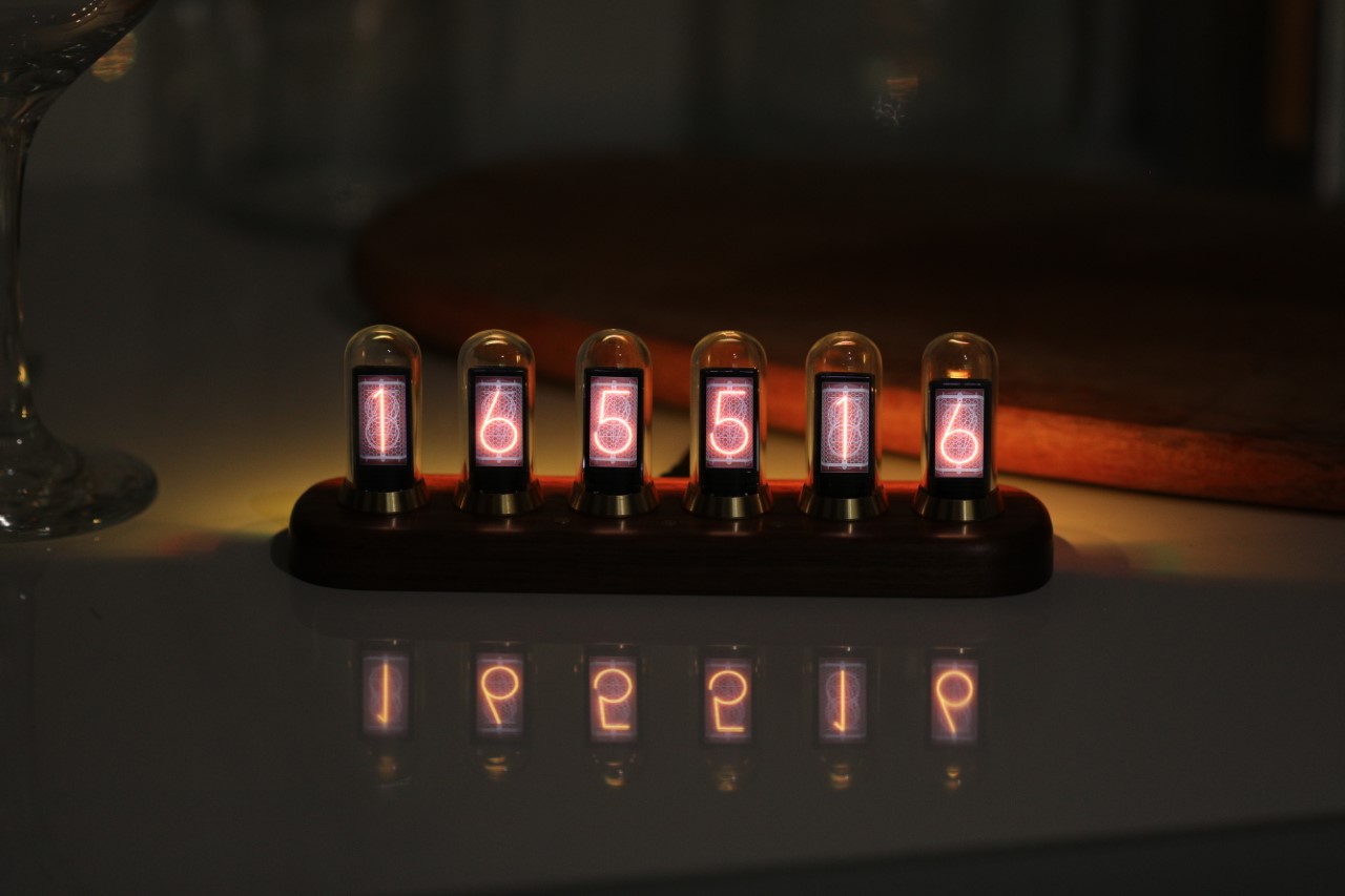 Retro-inspired nixie display with custom features lets you see the time, weather, stock prices, or your TikTok followers