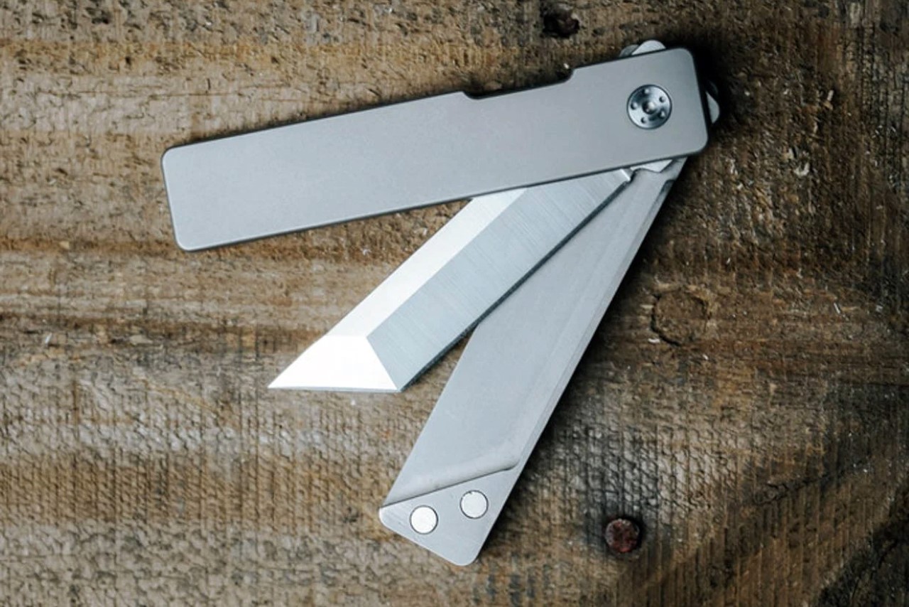 Classy titanium EDC pocket knife has a magnet-embedded split handle design and a Tanto-style blade