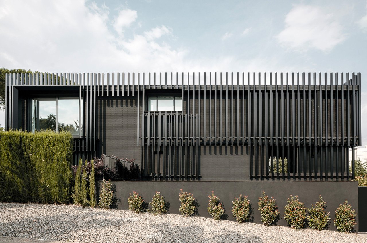 #This all-black house with vertical steel slats in Barcelona is the definition of a modern family home