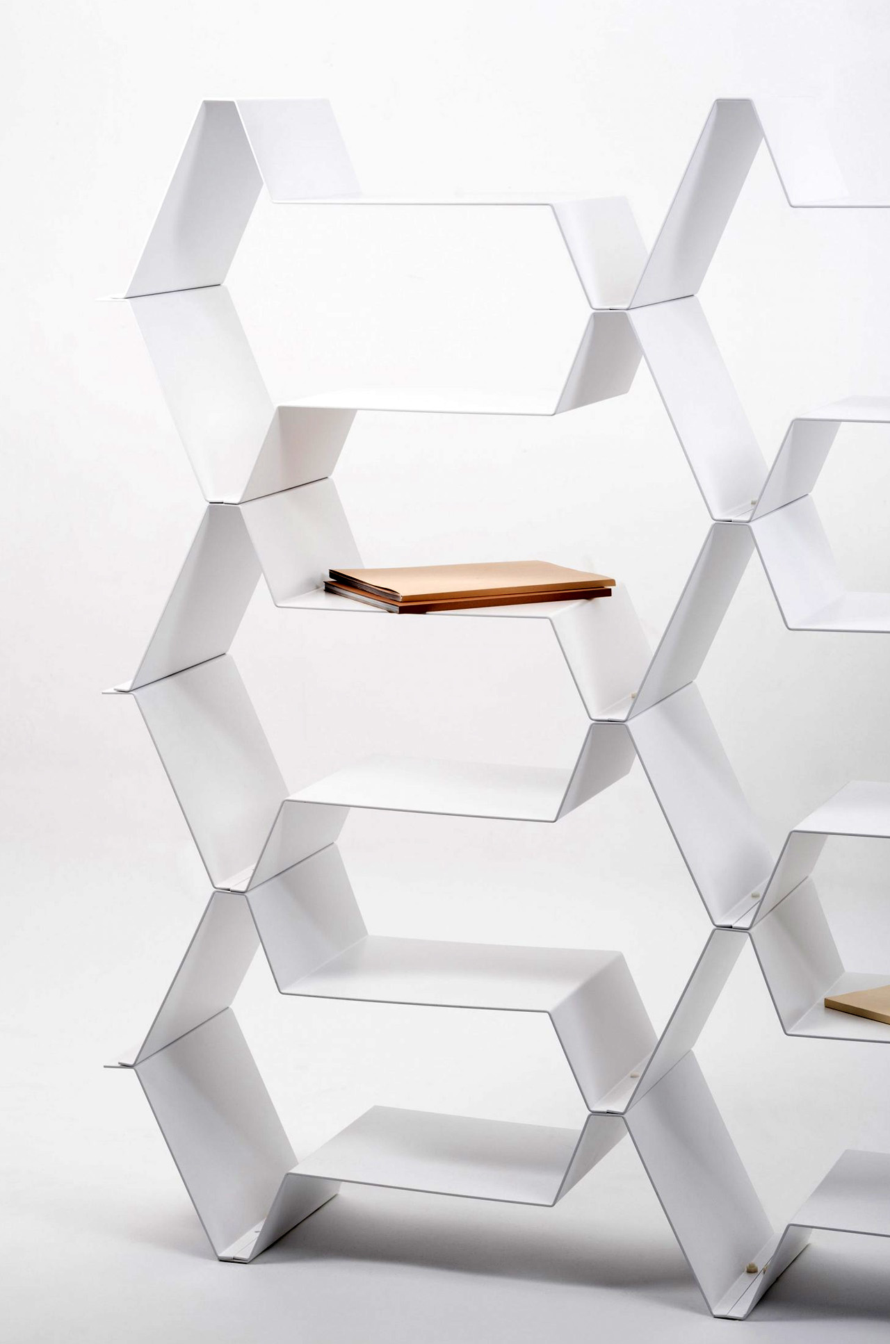 This minimal multifunctional furniture design can be configured into a bookcase, base unit or room divider