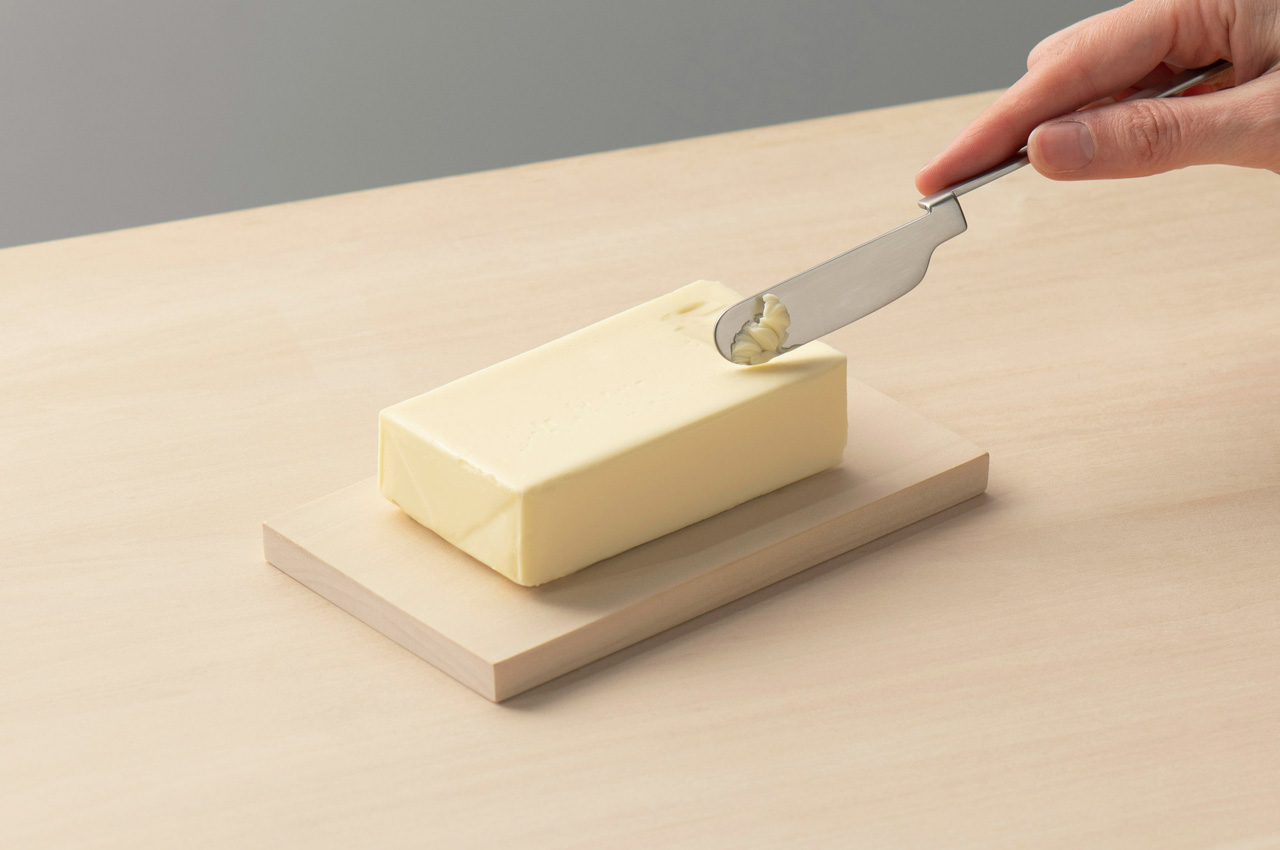 This minimal Japanese folding knife can be hooked onto the edge of a plate