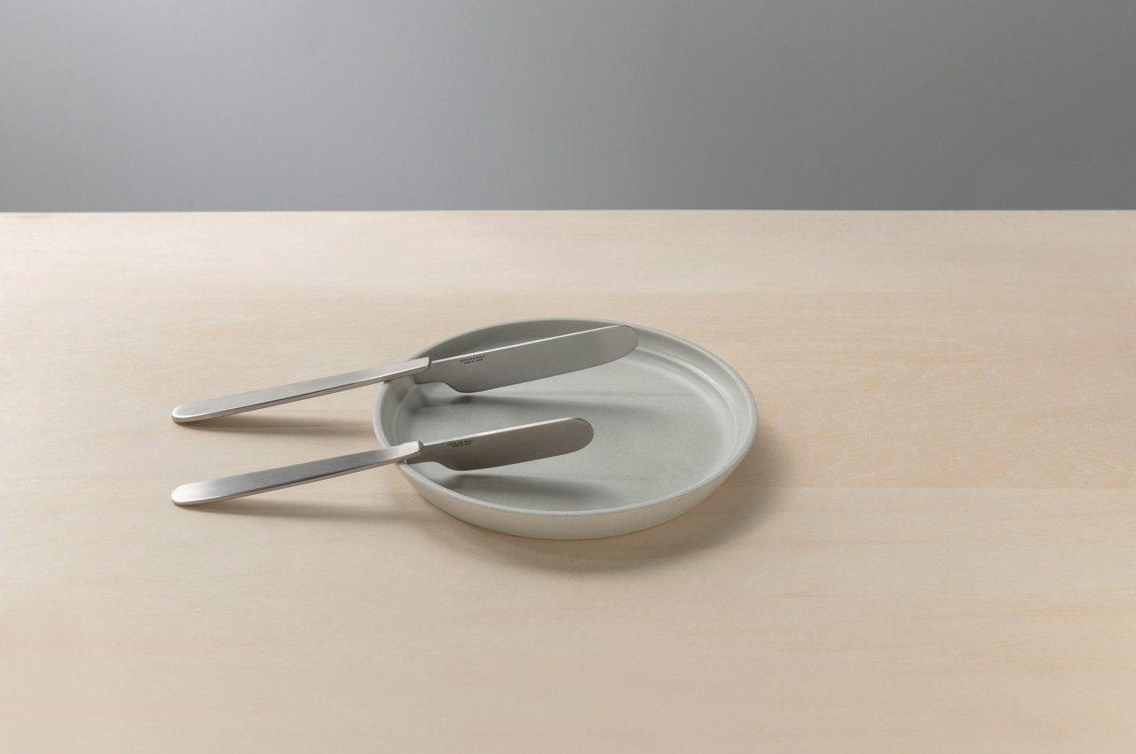 This minimal Japanese folding knife can be hooked onto the edge of a plate