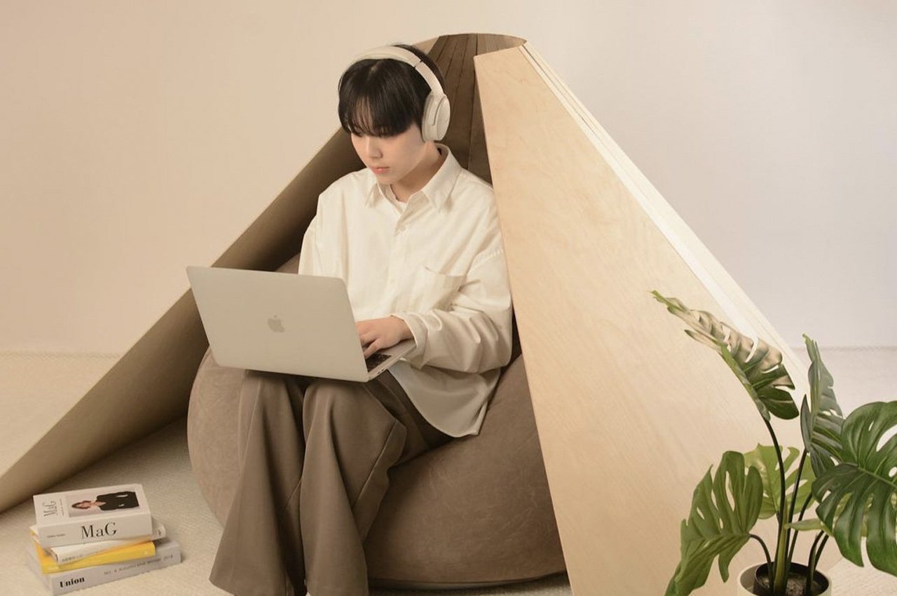 Fortune cookie-inspired wooden chair/work pod that literally opens up like a fortune cookie