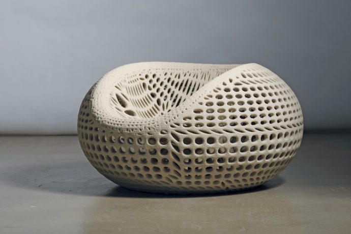 3D-printed concrete chair uses generative design for strength and a distinct hollow aesthetic