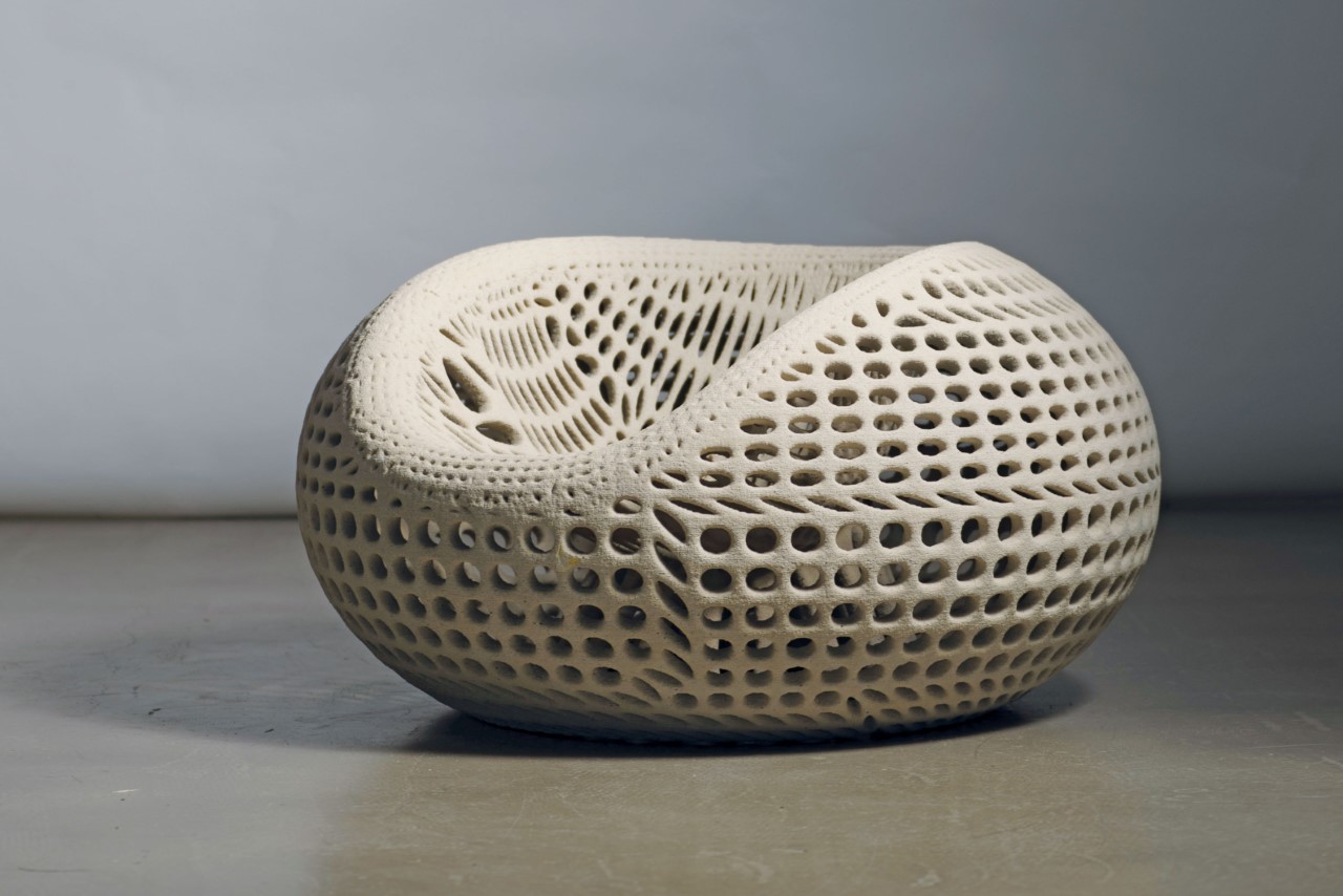 #3D-printed concrete chair uses generative design for strength and a distinct hollow aesthetic