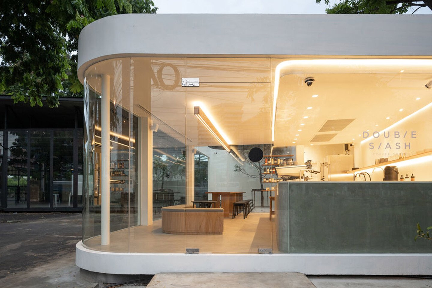 #Minimal cafe with glass panels + floating corners is a tranquil haven to grab a cup of joe in hectic Bangkok