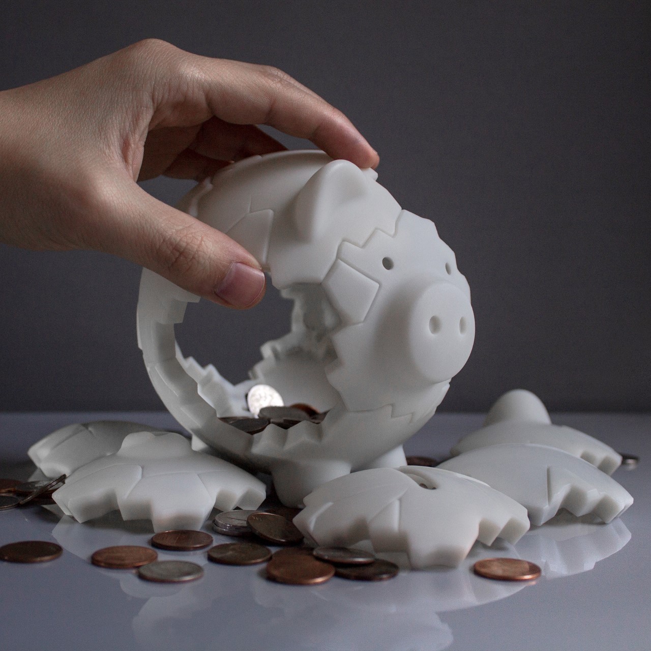 Magnetic Piggy Bank reassembles itself after being broken, becoming a  circular fidget-toy in the process - Yanko Design