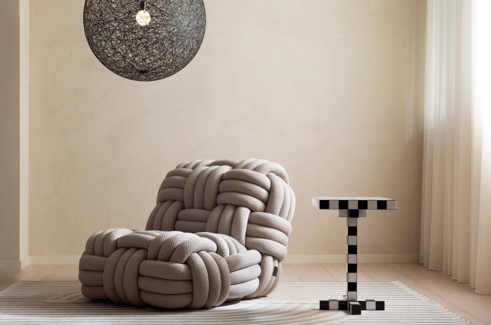 Large cozy cushy-looking armchair was inspired by the huge mooring ropes used for ships