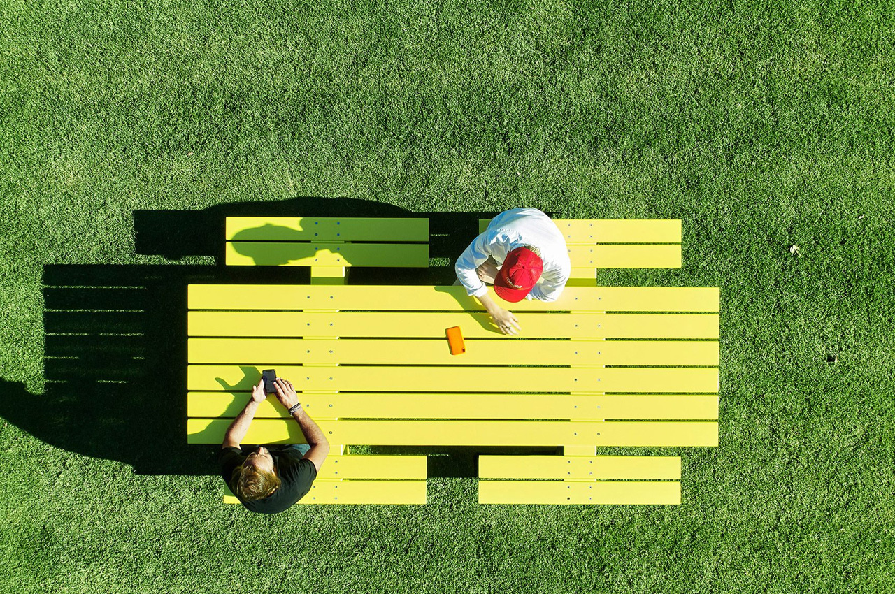 Bold yellow outdoor table is the stereotypical picnic table reimagined in a fresh + contemporary form
