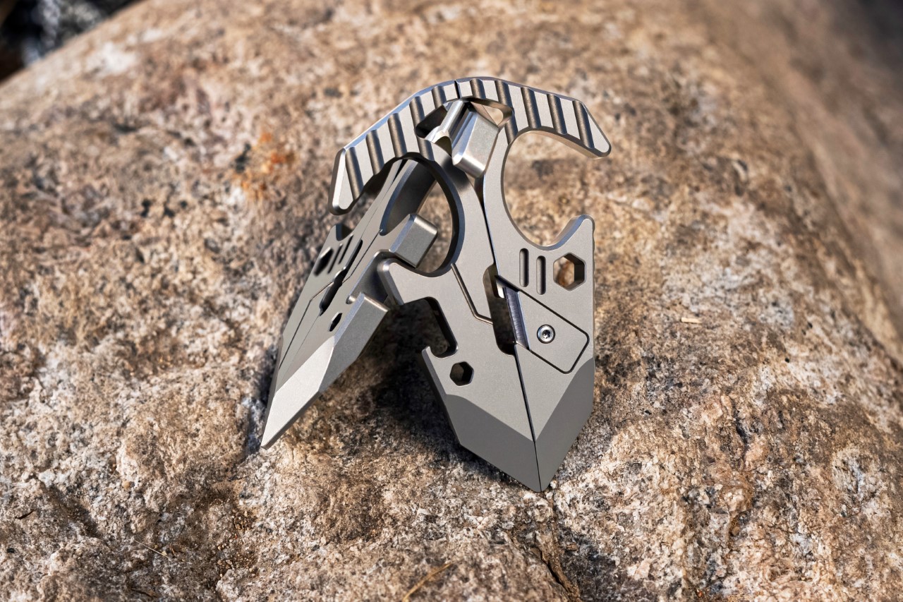 This Tactical Titanium EDC multitool splits apart to cleverly turn into an iPhone stand