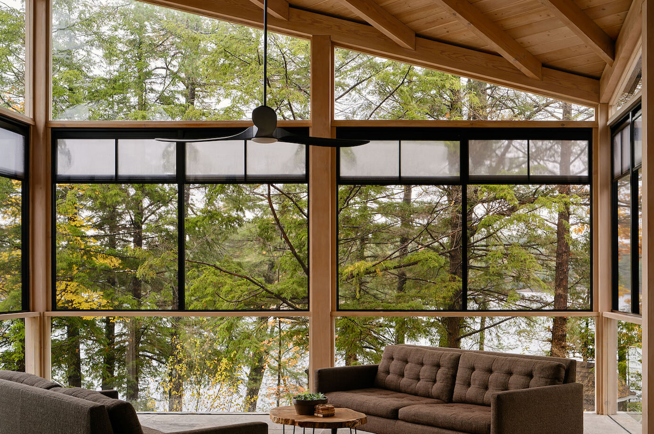 This idyllic wooden cabin overlooks a lake and the natural landscape of Ontario