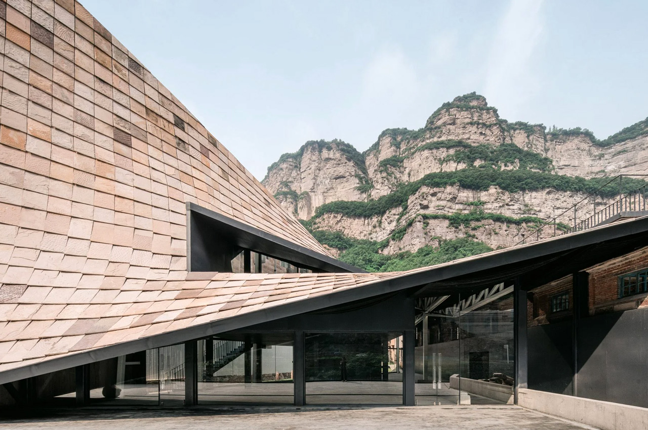 #Sculptural sloping roof was added to an art museum in China to help it merge into the mountainside