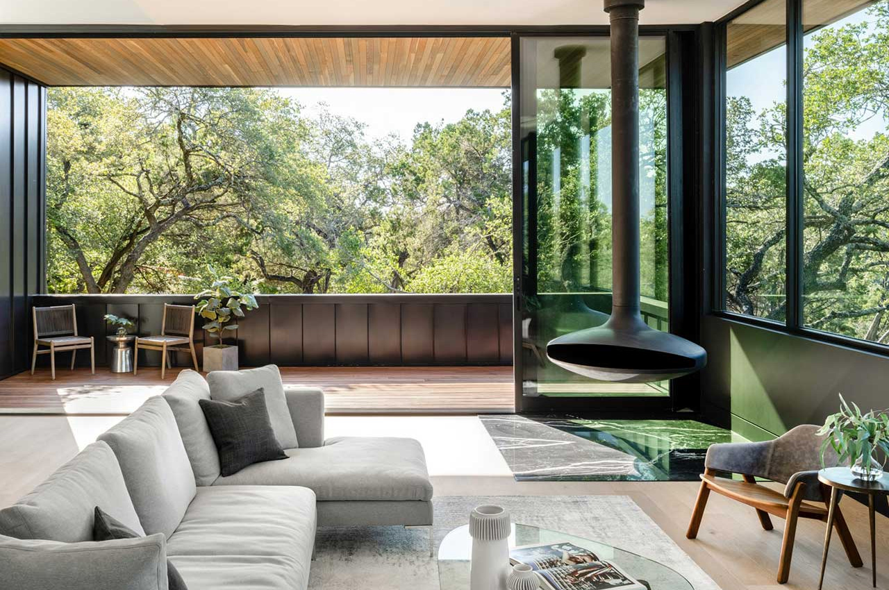 This contemporary and spacious home rests peacefully above the treetops of rolling hills in Texas