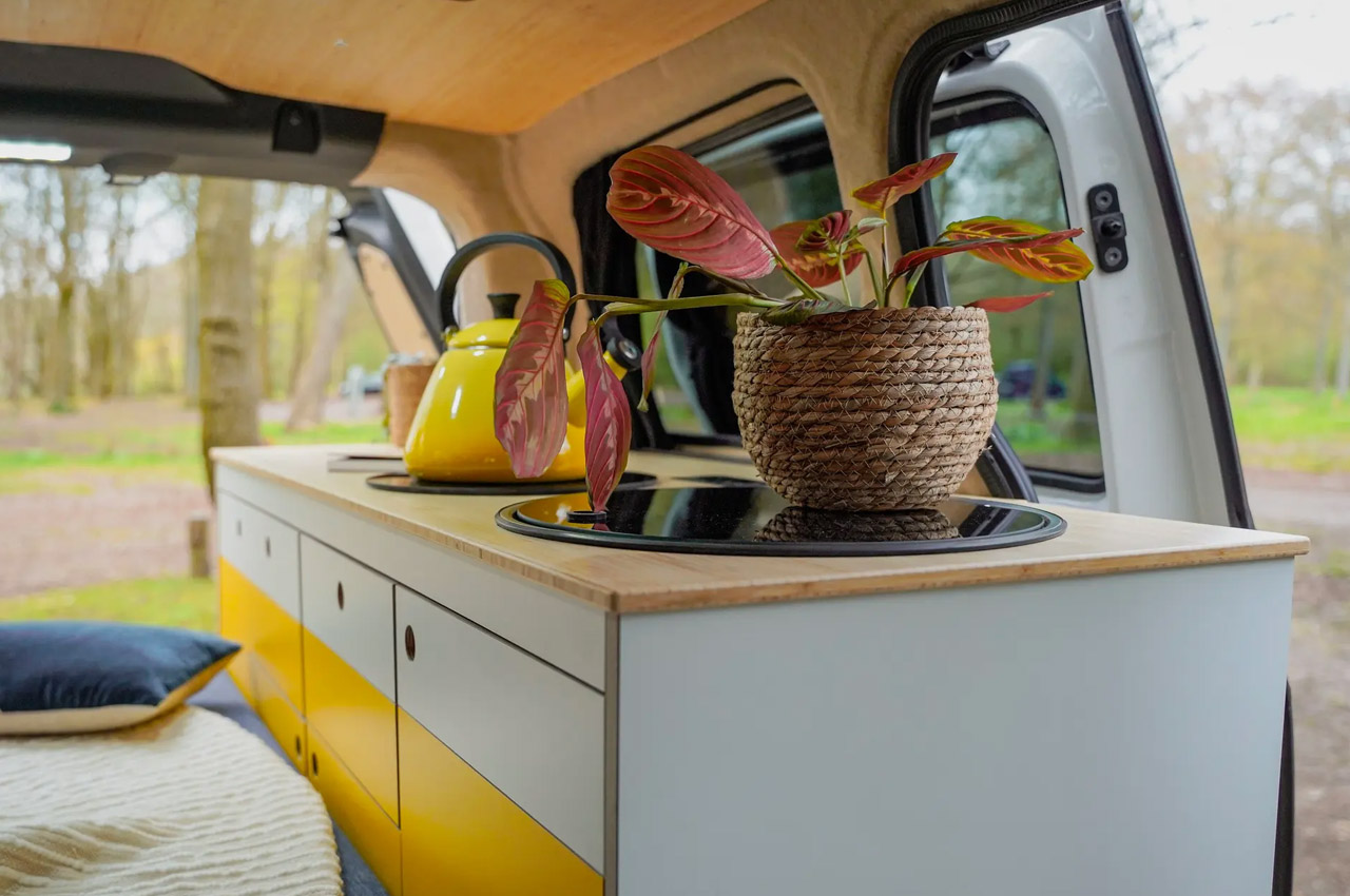 https://www.yankodesign.com/images/design_news/2023/05/vw-id-buzz-electric-camper-van-with-portable-toilet-and-mini-fridge-is-a-vibrant-luxury-hotel-on-wheels/Volkswagen-ID-Buzz-camper-van-10.jpg