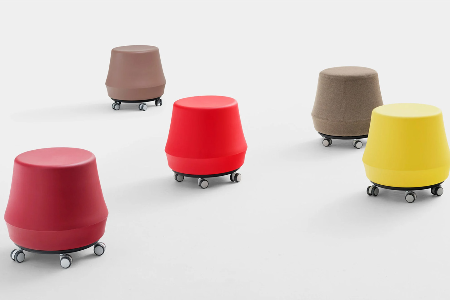 #This colorful stumpy stool with wheels is perfect for indoors and outdoors