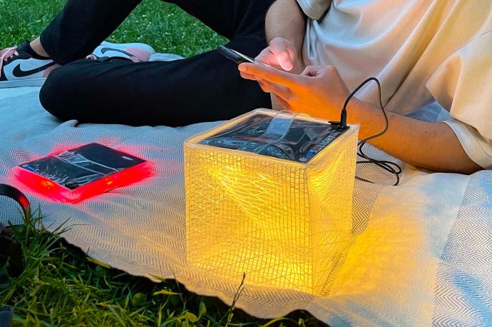 This charming origami-inspired cube brings both light and power anywhere you need them