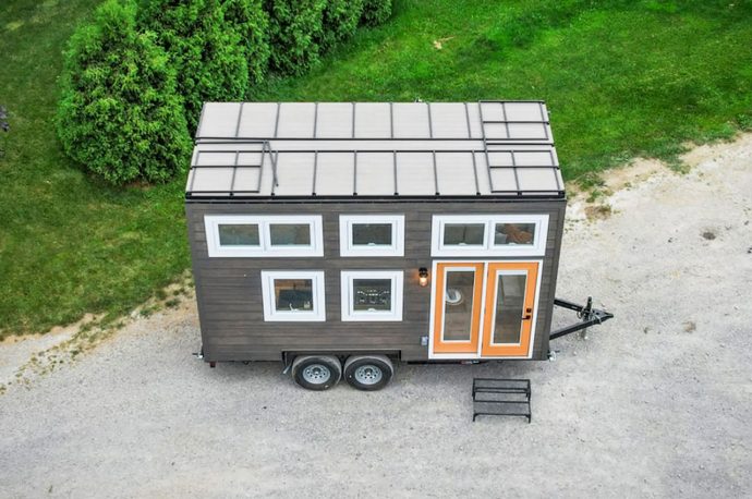 Modern Tiny Home Features A Rooftop Deck & Space-Saving Interior With A Pulley Operated Ladder