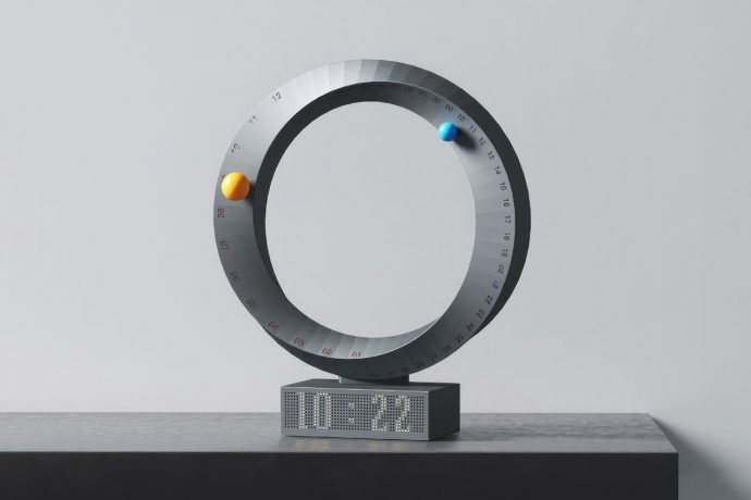 Floating Marbles help this hypnotic Mobius Calendar tell the date and time in cosmic style