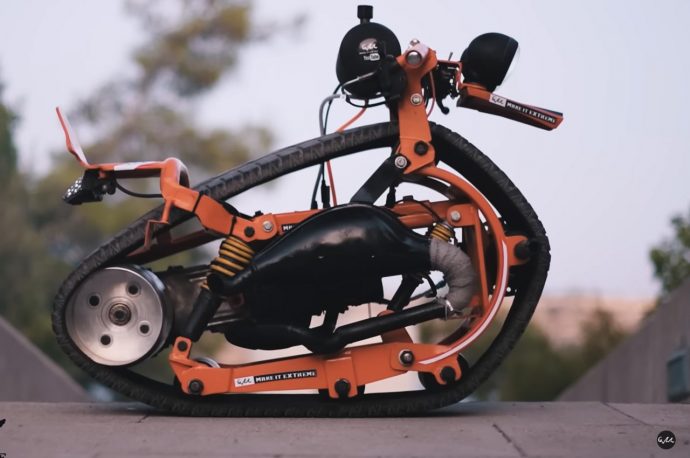 Monotrack Bike made out of old car tire performs smooth wheelies even if you’ve got zero skills