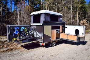 This compact camping trailer is space-rich with storage for up to four bikes and room to sleep four