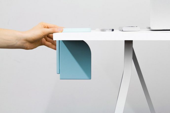 This portable hard drive concept hides under the table to save desk space